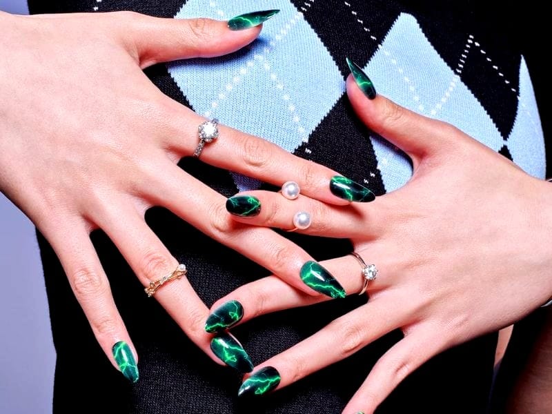 What does green nail polish symbolize