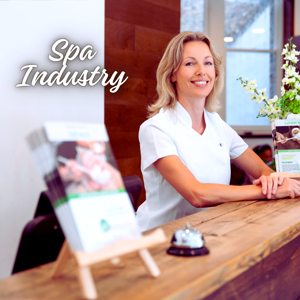 Smiling spa receptionist at wooden counter, welcoming clients.