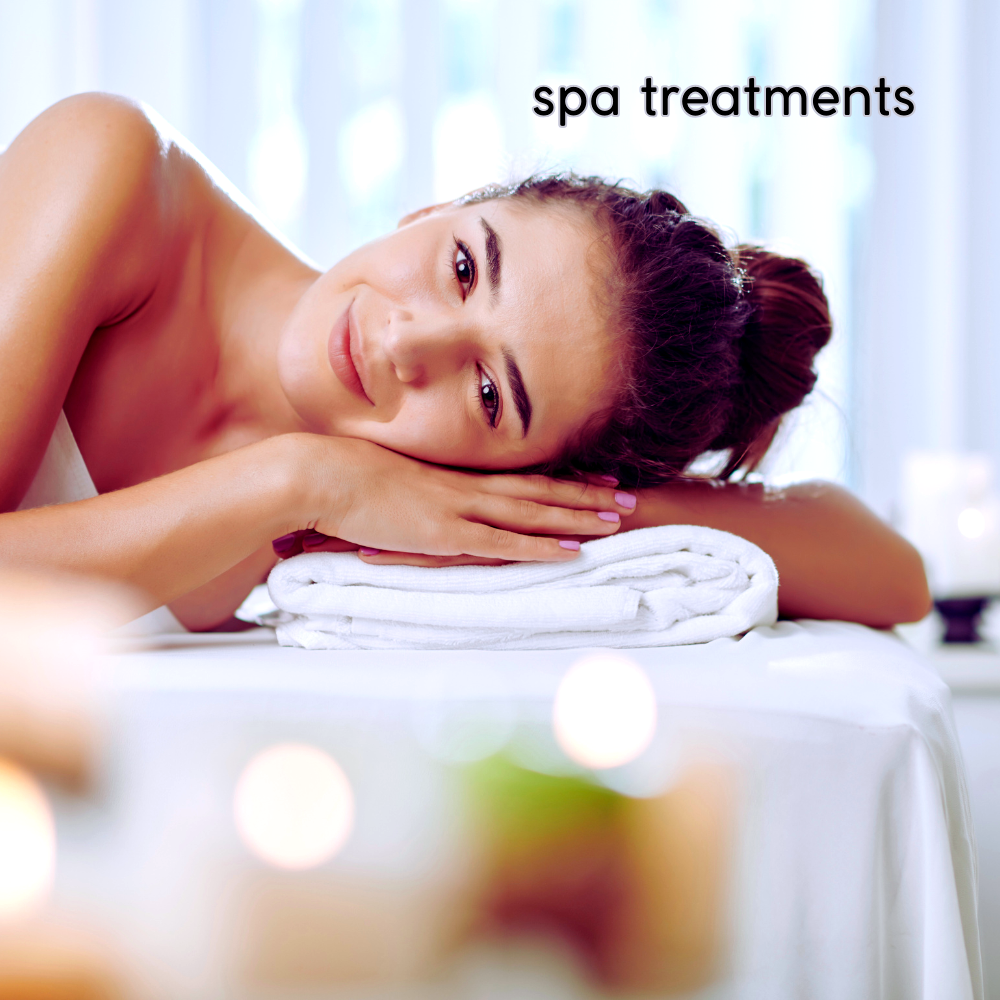 Relaxed woman enjoying spa treatment on massage table.