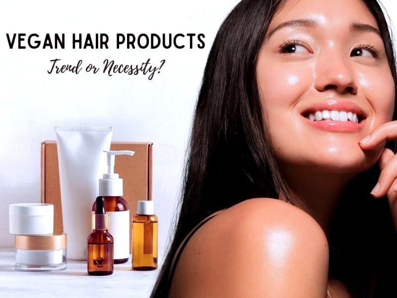 A glowing woman with healthy, sleek hair smiles next to elegantly arranged bottles of vegan hair products, promoting ethical beauty choices.