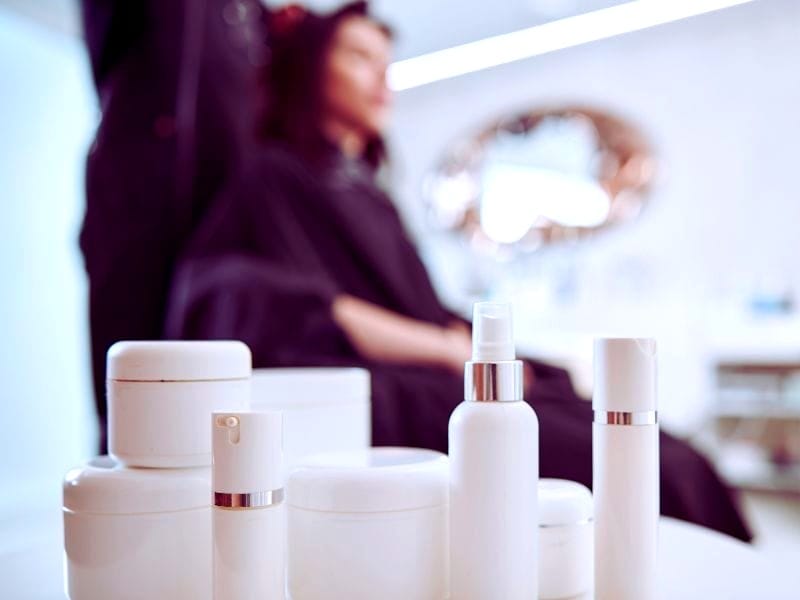 A collection of sleek haircare products in a salon setting, highlighting modern haircare innovation.