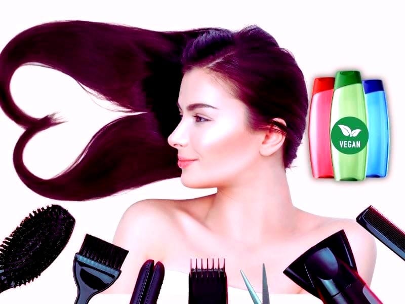 A woman with flowing, shiny hair shaped into a heart, surrounded by salon tools and vegan product bottles, symbolizing sustainable haircare practices.