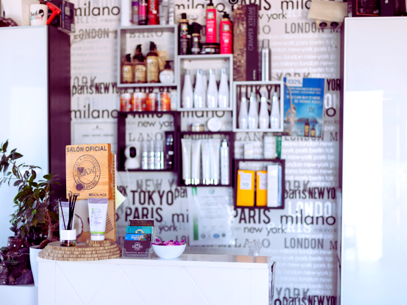 Salon display showcasing a variety of premium vegan hair products for eco-conscious clients.