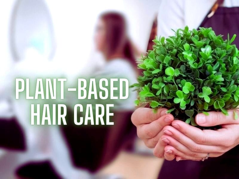 Image of hands holding a small green plant with the text 'plant-based hair care' displayed prominently.