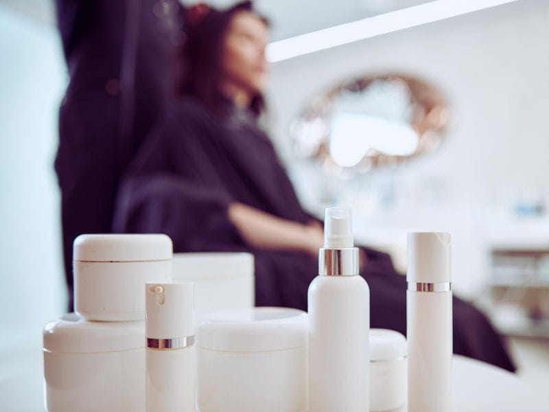 Clean beauty haircare products on a salon counter, promoting eco-friendly, non-toxic hair solutions