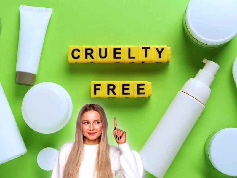 Smiling woman pointing to 'Cruelty Free' text with bottles and jars, promoting cruelty-free hair products.