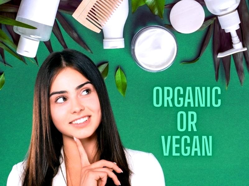 Image of a woman pondering organic or vegan hair care, showcasing the difference between organic and vegan hair care products.