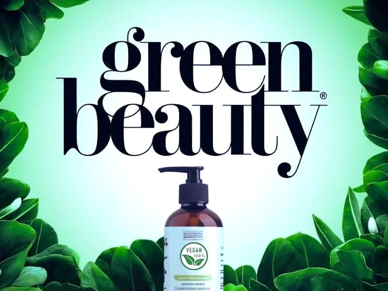 Green Beauty banner highlighting a vegan hair care product surrounded by lush green leaves.