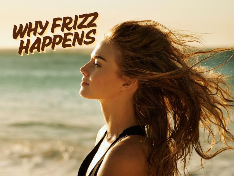 Close-up of a woman with frizzy, windblown hair at the beach, illustrating the effects of humidity and environmental factors on hair health.