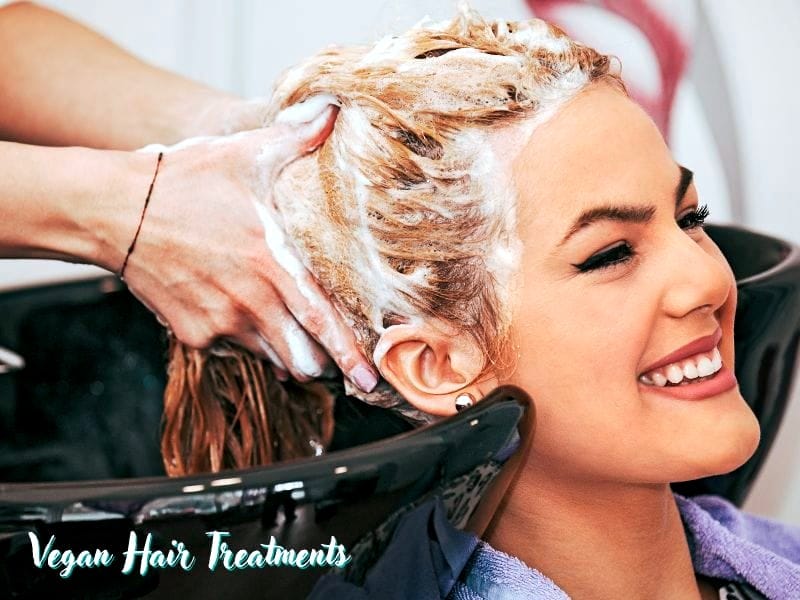 Client enjoys a refreshing salon wash with vegan hair treatments, designed for healthier, eco-friendly hair.