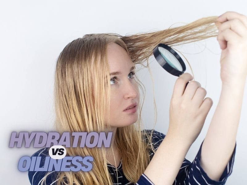 Woman examining hair with magnifying glass, text overlay: 'Hydration vs Oiliness.