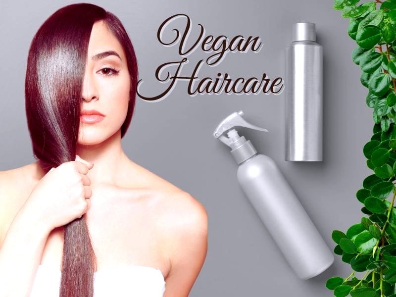 Woman with sleek, shiny hair showcasing vegan haircare products with a natural green leaf background.