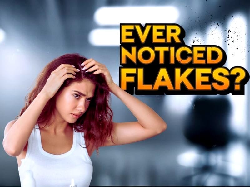 Concerned woman examining her scalp for flakes, with bold text asking, 'Ever noticed flakes?' in a salon setting.